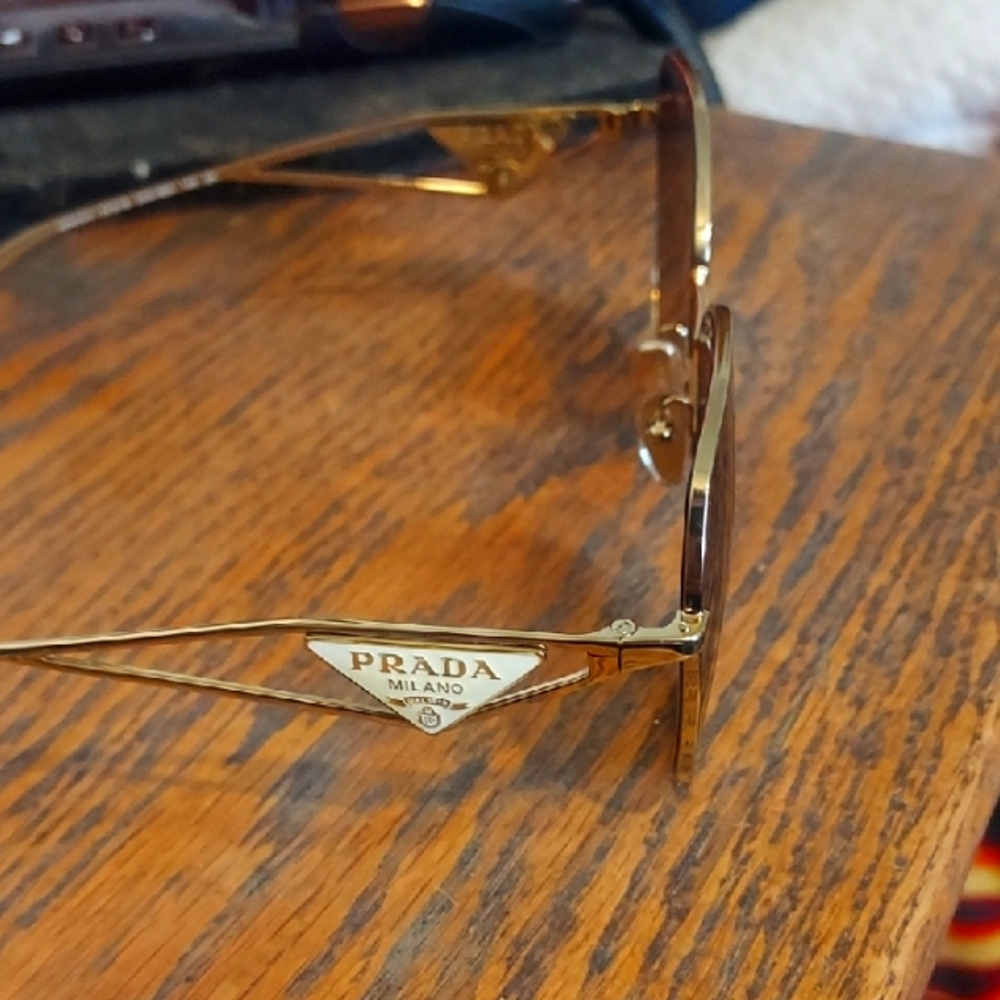Prada Sunglasses in Gold